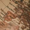 Close-up of a classic globe, centered on Europe and surrounding regions, with visible city and country names. European Union
